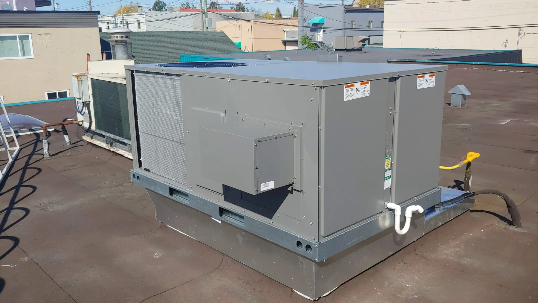 Commercial rooftop HVAC installation with connected ductwork