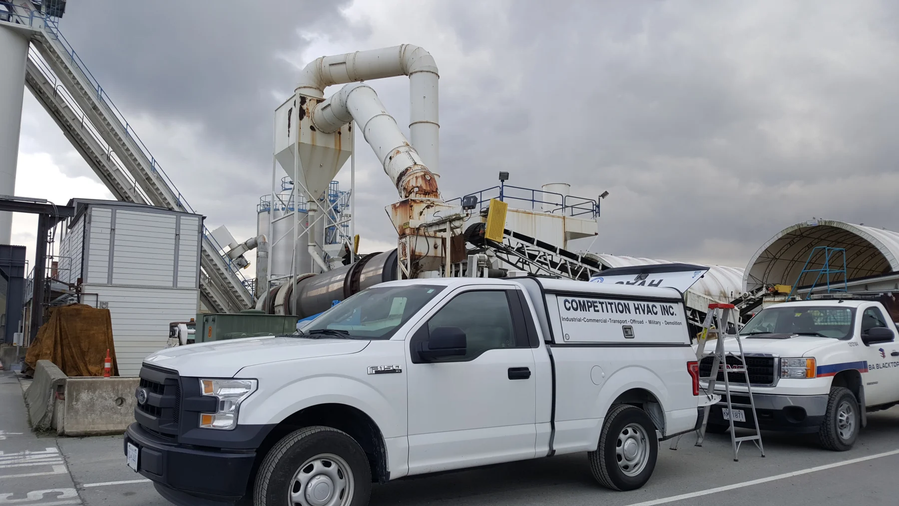 Competition HVAC service vehicles at an industrial facility